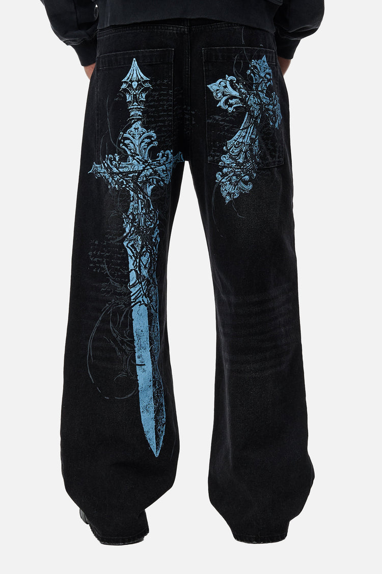Back view of the black Blade Denim with the light blue sword and cross print on the legs