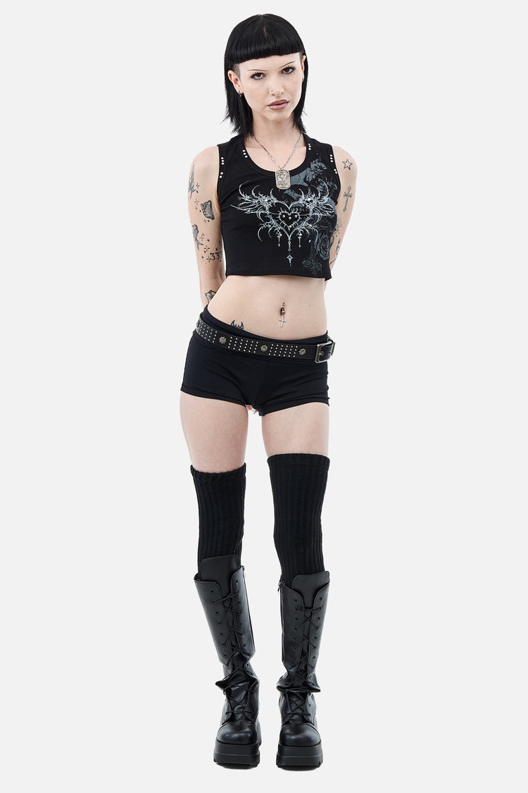 Full-length front view of the Black Sigil Tank styled with shorts and black boots