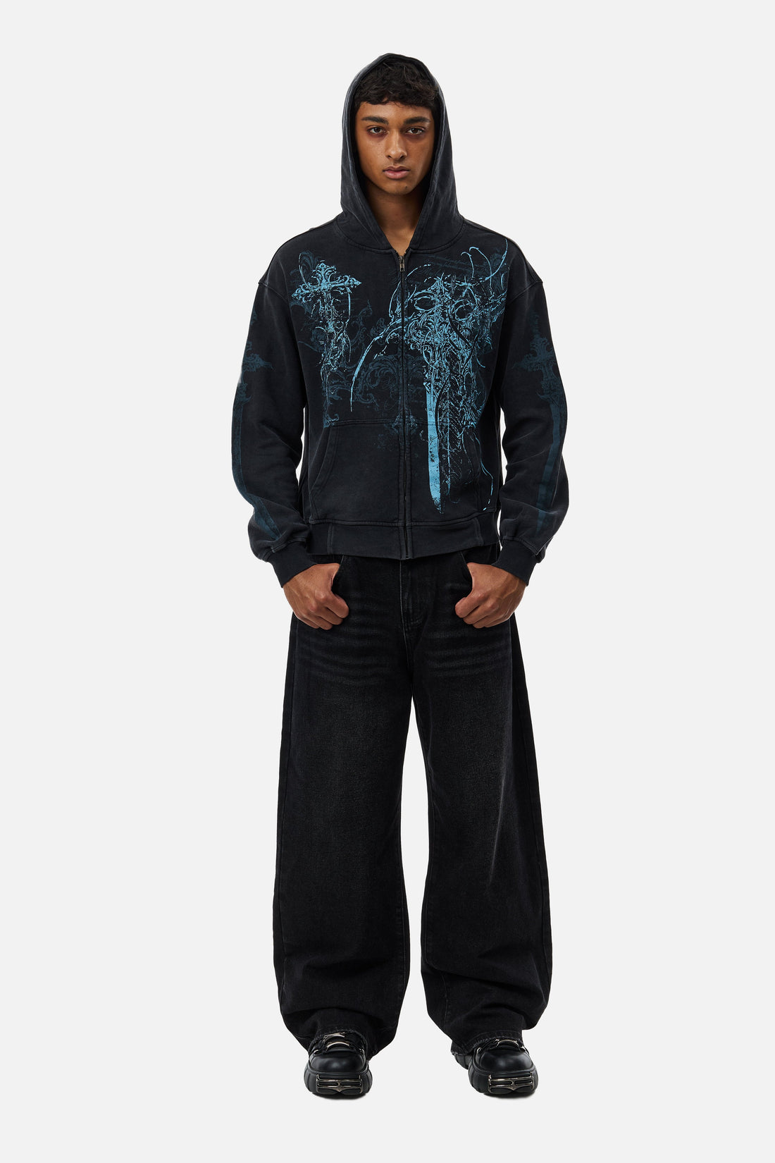 Full-length front view of the Blade Hoodie with hood up and black baggy jeans