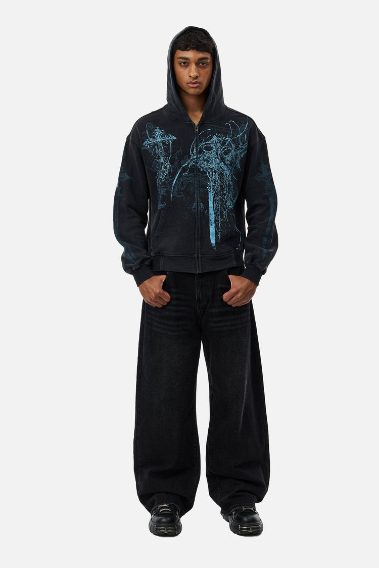 Full-length front view of the Blade Hoodie with hood up and black baggy jeans