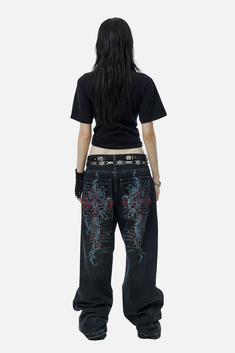 Full-length back view of a model in the Blessed Outlaw Denim with a cropped black tee