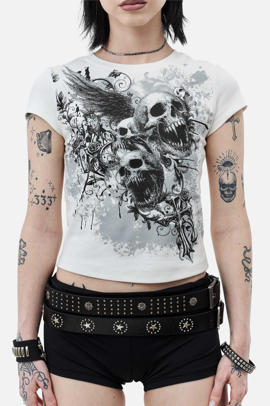 Close front view of the Skulls Tee print with winged skulls and gothic cross