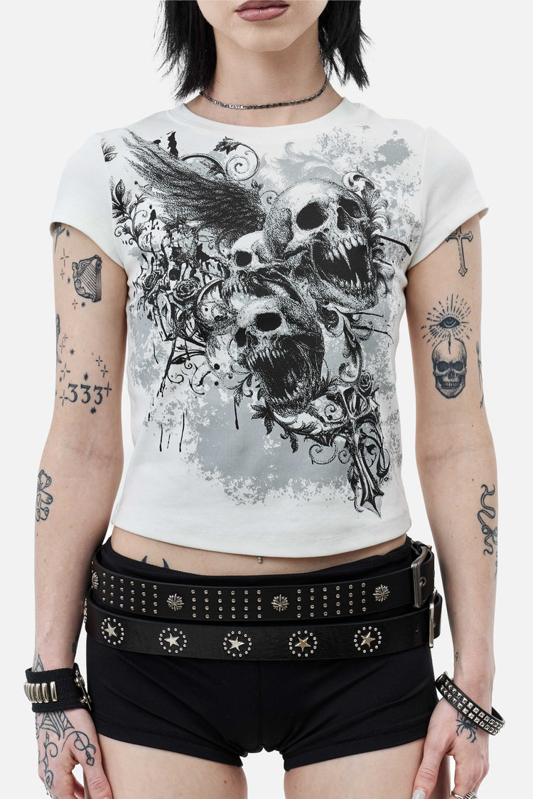 Close front view of the Skulls Tee print with winged skulls and gothic cross