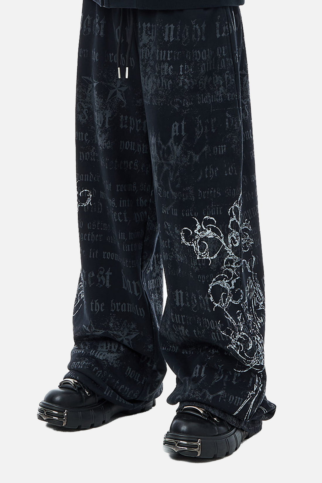 Side view of the navy Sacred Sweatpants with gothic text and white floral print