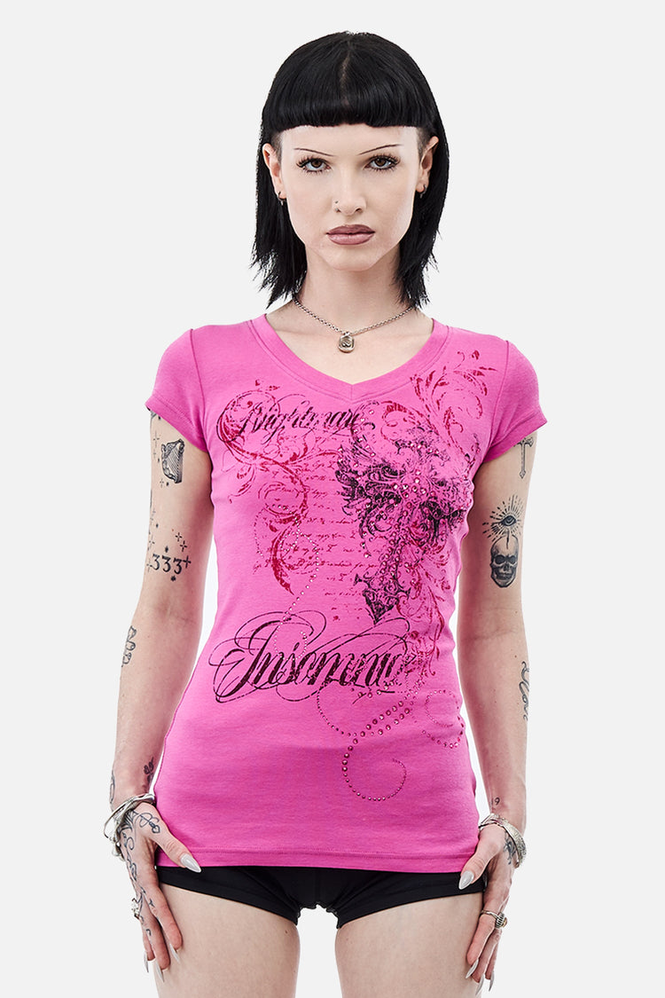 Model in the pink Lovers V-Neck T-Shirt with black script and cross graphic, front view