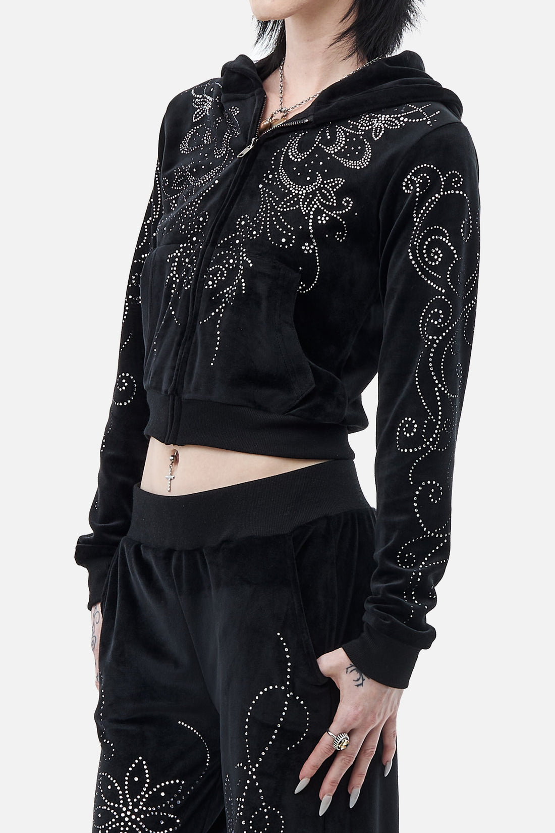 Side view of the cropped Velour Flutter Hoodie with rhinestone swirls down the sleeve