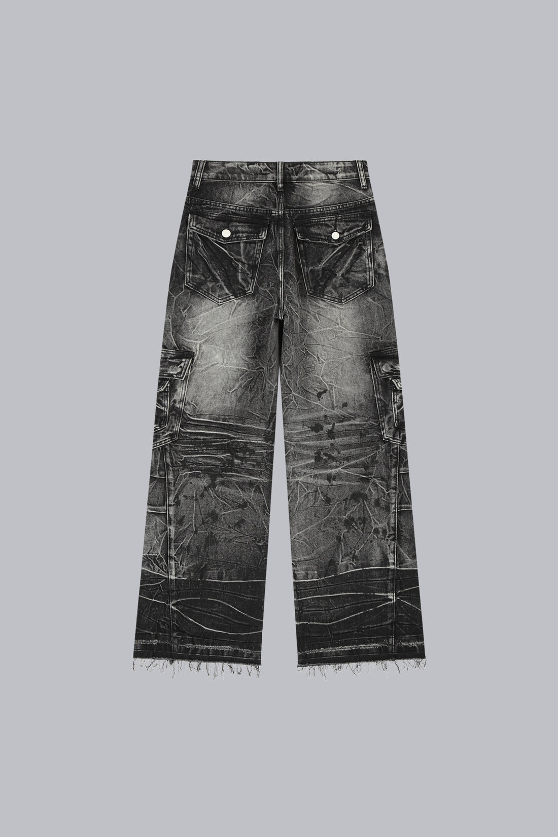 Fractured Denim laid flat, back view, showing crinkle wash and raw frayed hems