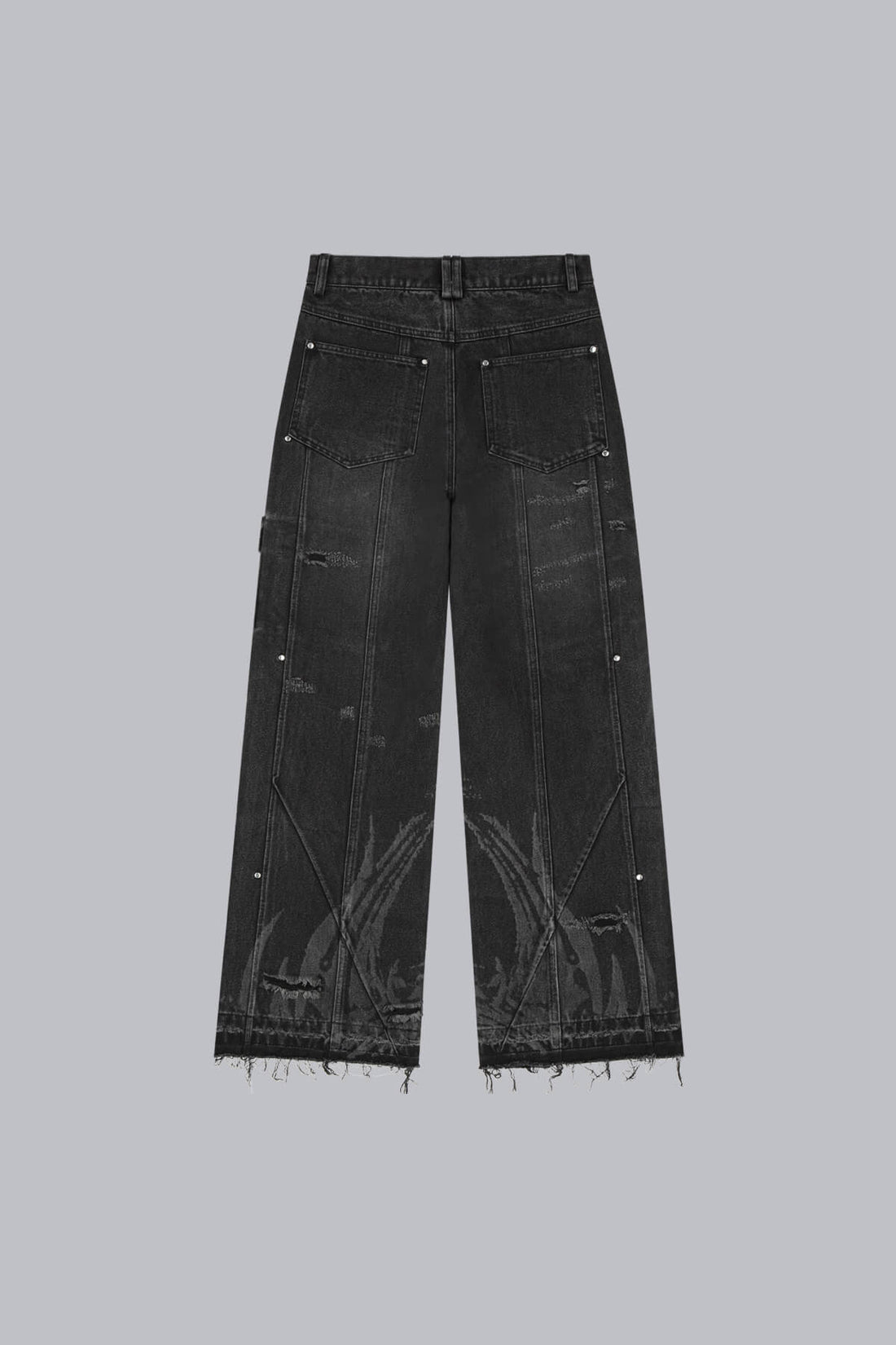 Back of the Destroyer Denim laid flat, with distressed knees and raw frayed hems