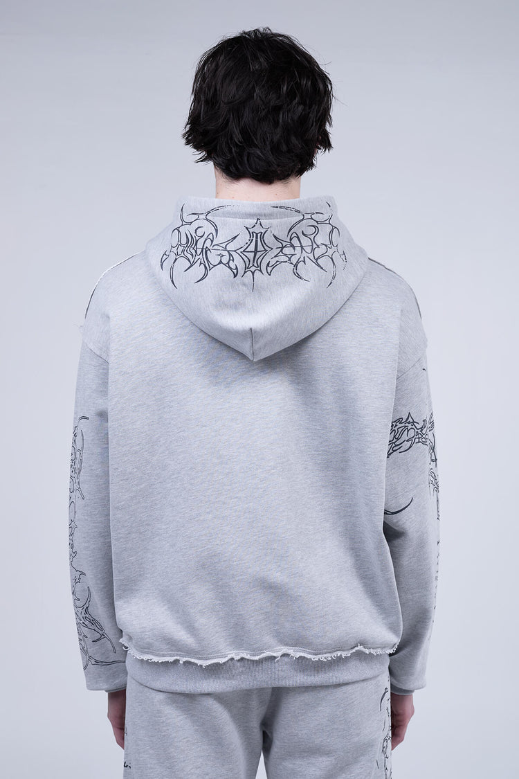 Back view of the Gray Sigil Zip Hoodie showing the tribal graphic across the hood