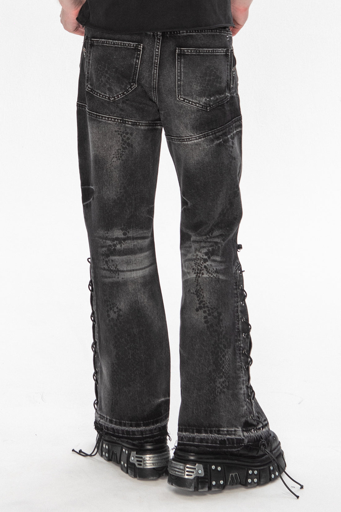 Back close view of the Snakeskin Flared Denim with lace-up sides over platform boots