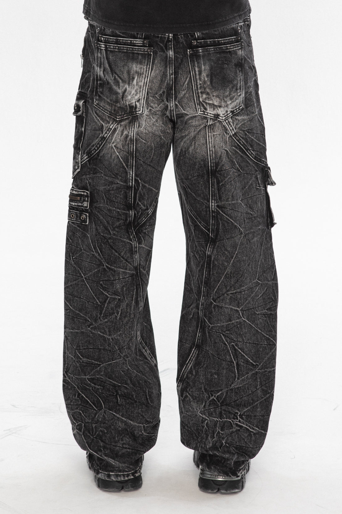 Back view of the Utility Denim showing the crinkled black wash and cargo pockets