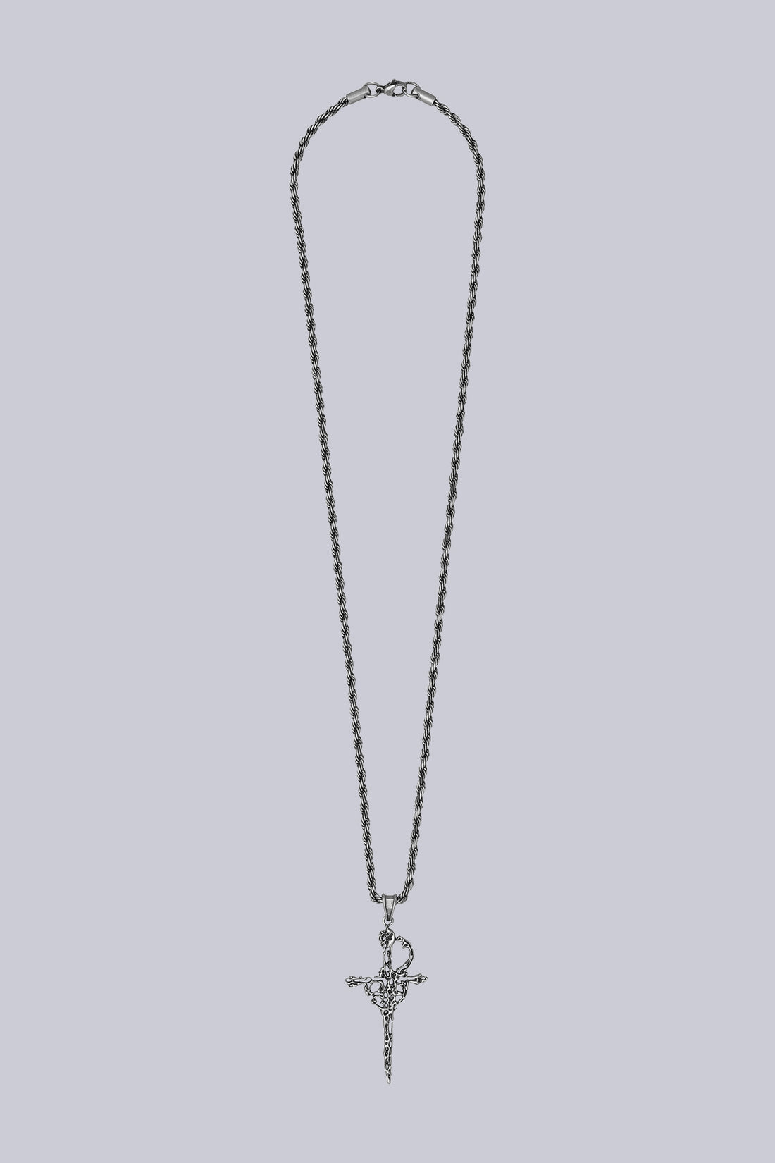 Dagger Necklace laid flat on grey, silver rope chain with ornate dagger pendant