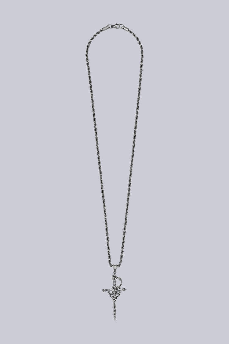 Dagger Necklace laid flat on grey, silver rope chain with ornate dagger pendant
