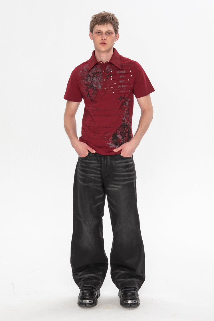 Full-length view of the red Thorns Polo with coated black baggy jeans