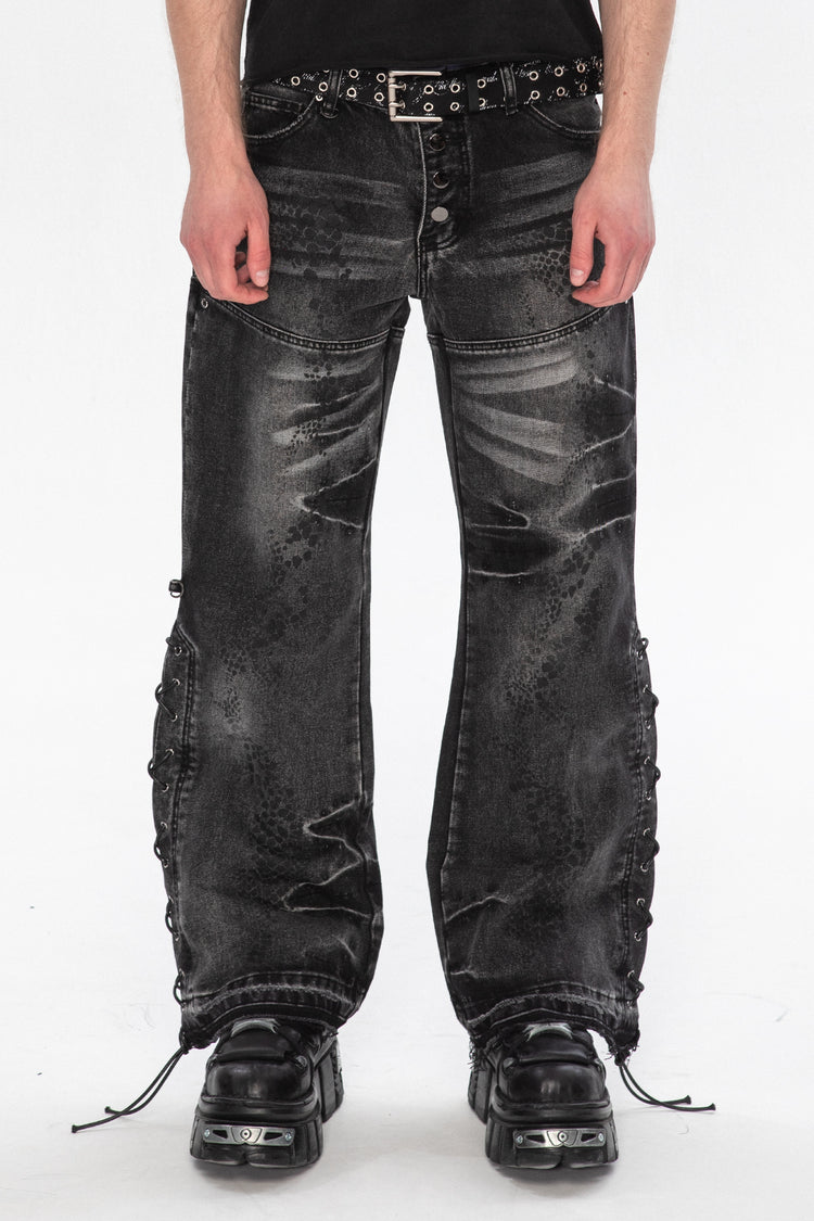 Front close view of the Snakeskin Flared Denim showing lace-up side seams and flared legs