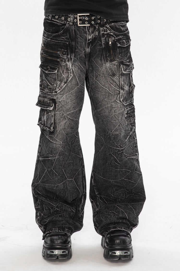 Front view of the Utility Denim, washed black cargo jeans with crinkle wash and studded belt