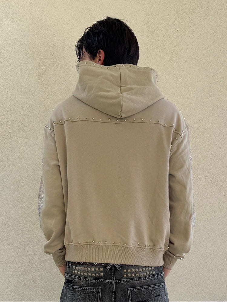 Back view of the sand IVLA Zip Up Hoodie showing stud trim across the shoulders