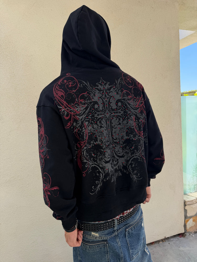 Back view of the Black Scripture Eclipse Zip Up Hoodie outdoors, showing the gothic back print