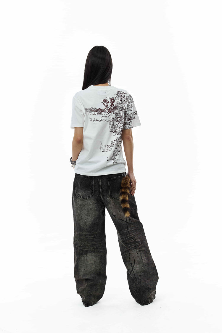 Full-length back view of the White Messages Tee with wide black jeans