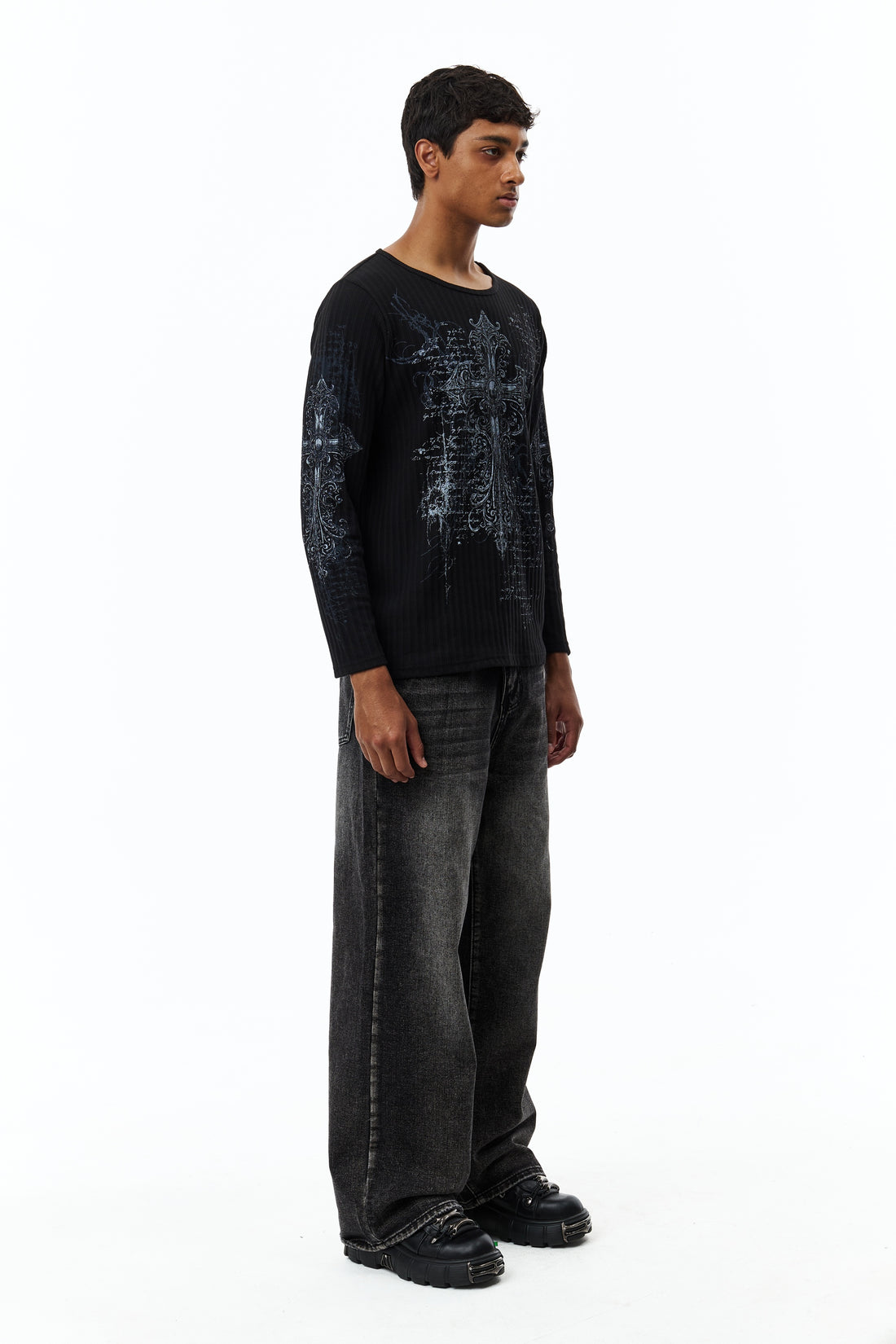 Full-length side view of the Scripture Ribbed Long Sleeve with faded black wide jeans
