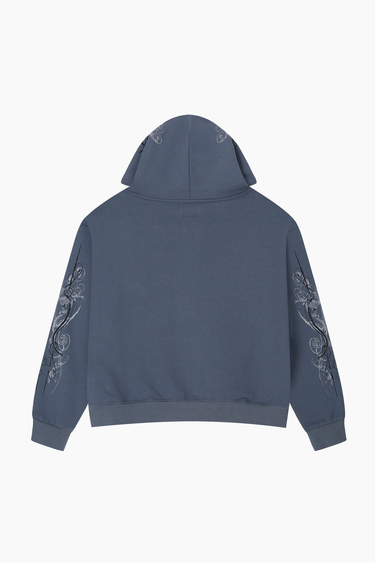 Back of the Midnight Blue Crux Hoodie laid flat, showing the scrollwork prints on both sleeves