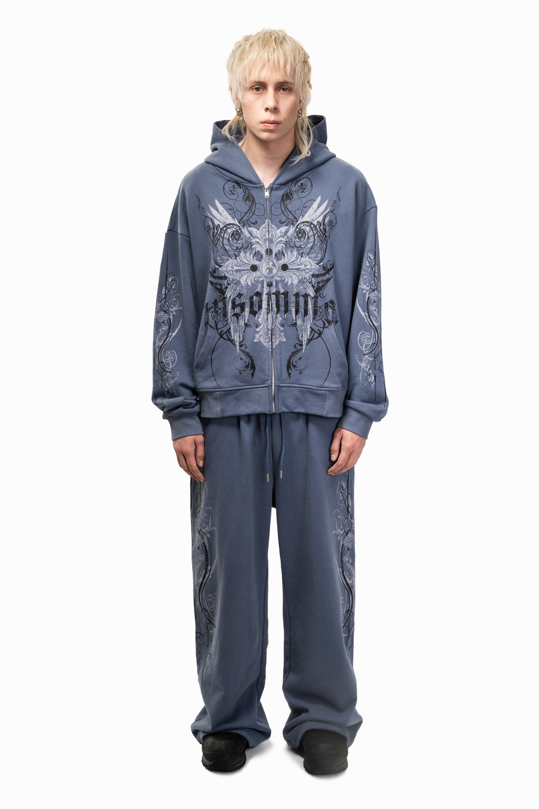 Model in the Midnight Blue Crux Sweatpants and matching Crux hoodie, full-length front view