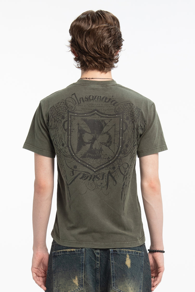 Back view of the olive Studded Wings Tee showing the studded shield crest print