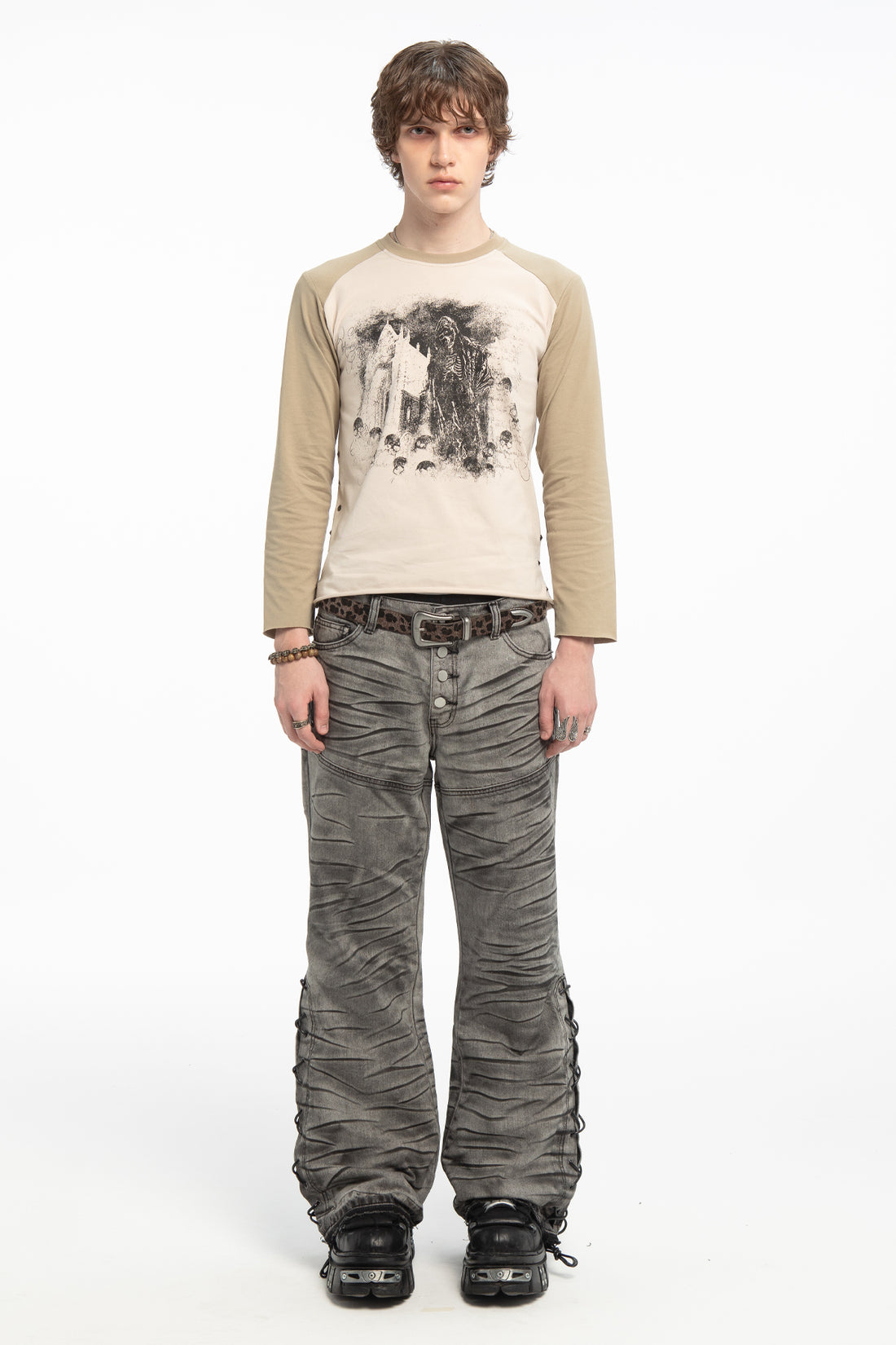 Full-length front view of the Reaper Raglan Long Sleeve with grey wide-leg jeans