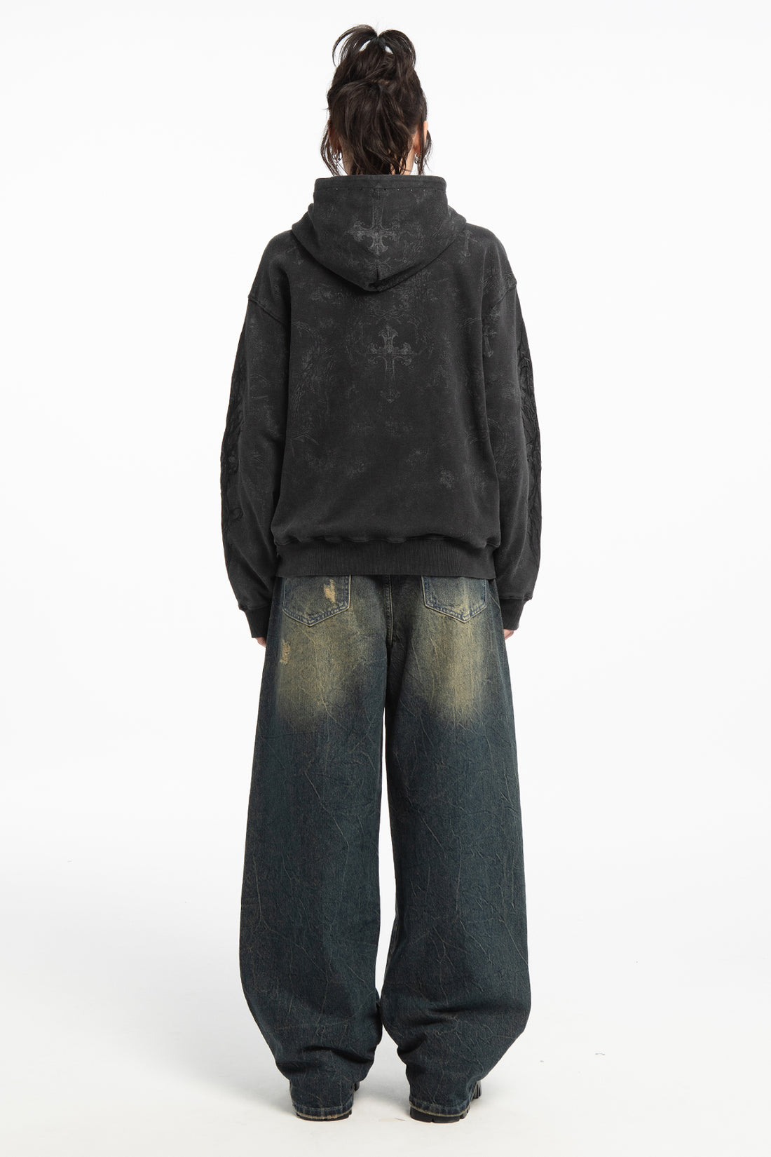 Full-length back view of the Sand Outlaw Denim with a washed black hoodie