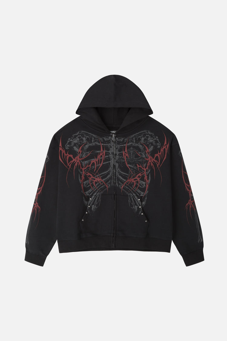 Front of the black Skeleton Hoodie laid flat, showing ribcage print, red thorns and studs