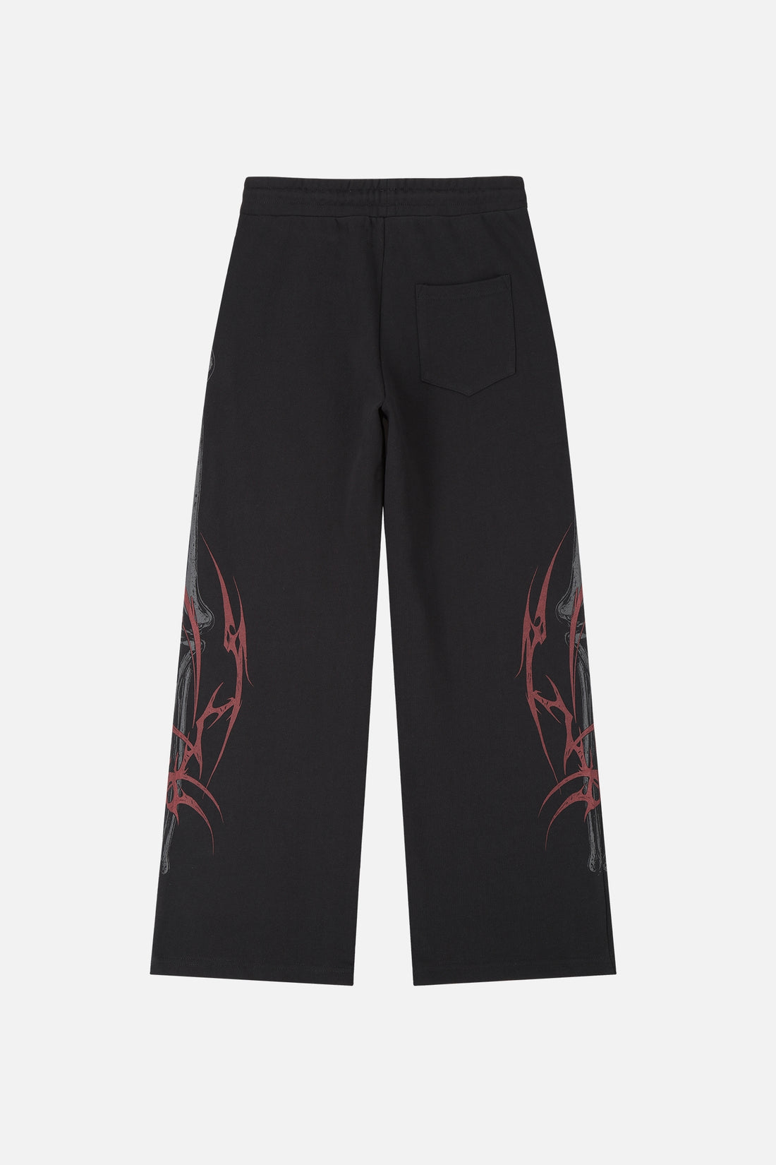 Back of the black Skeleton Sweatpants laid flat showing red tribal side graphics