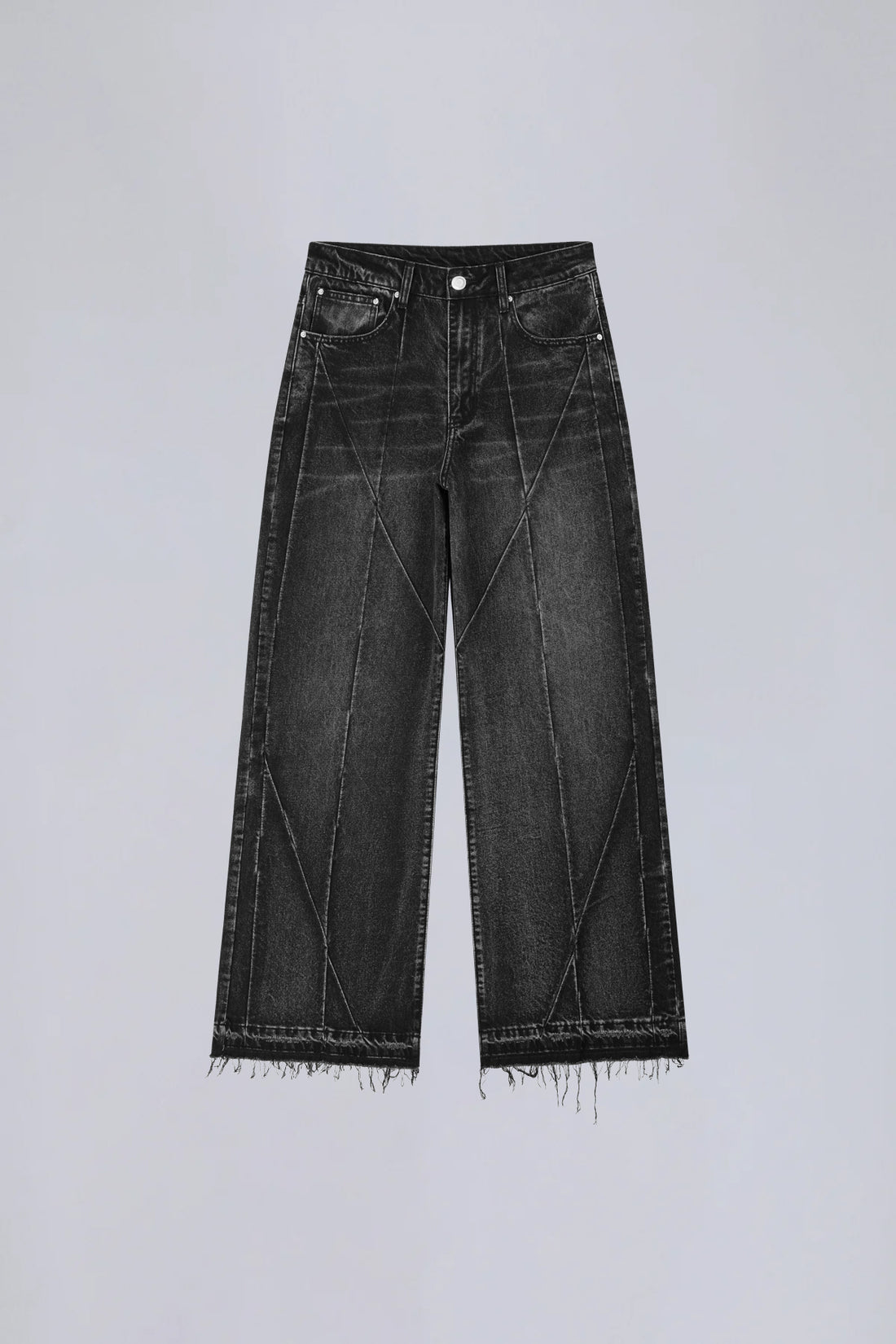 Front of the washed black Vex Denim laid flat with curved panel seams and raw hems