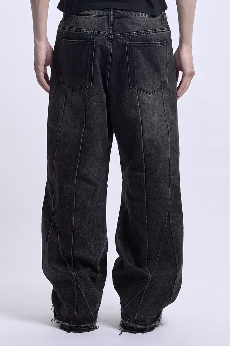 Back view from the waist down of the washed black Vex Denim showing curved seams