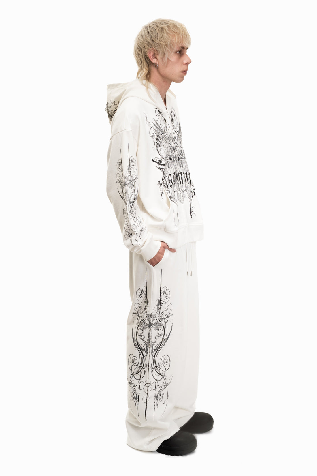 Full-length side view of the White Crux Hoodie with matching printed sweatpants