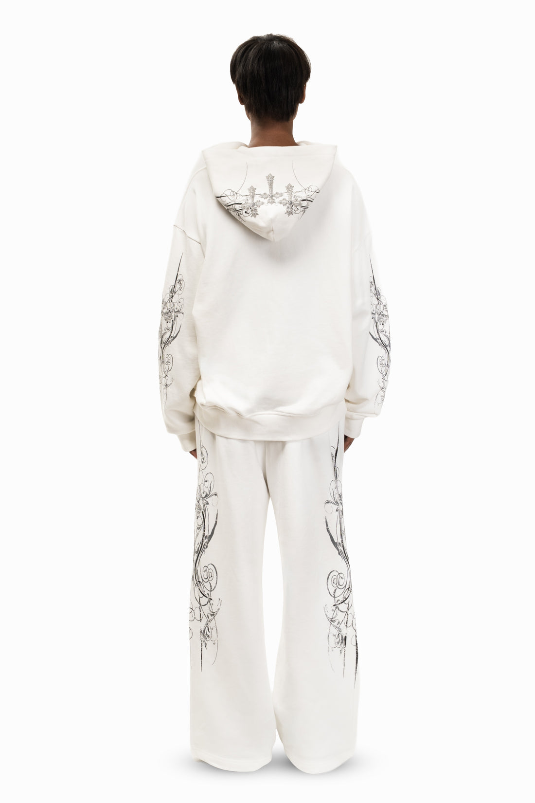 Back view of the White Crux Sweatpants and matching hoodie with printed hood, full-length