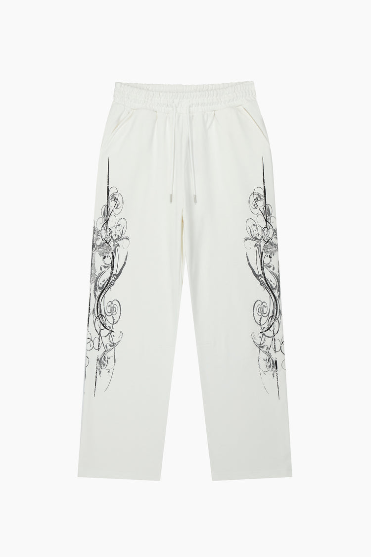 Front of the White Crux Sweatpants laid flat with black filigree crosses down both legs