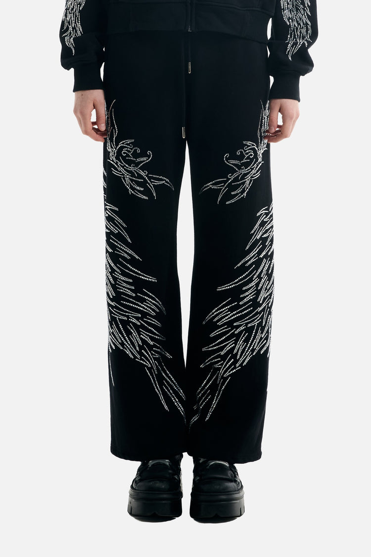 Front view from the waist down of the black All Over Wings Rhinestone Sweatpants