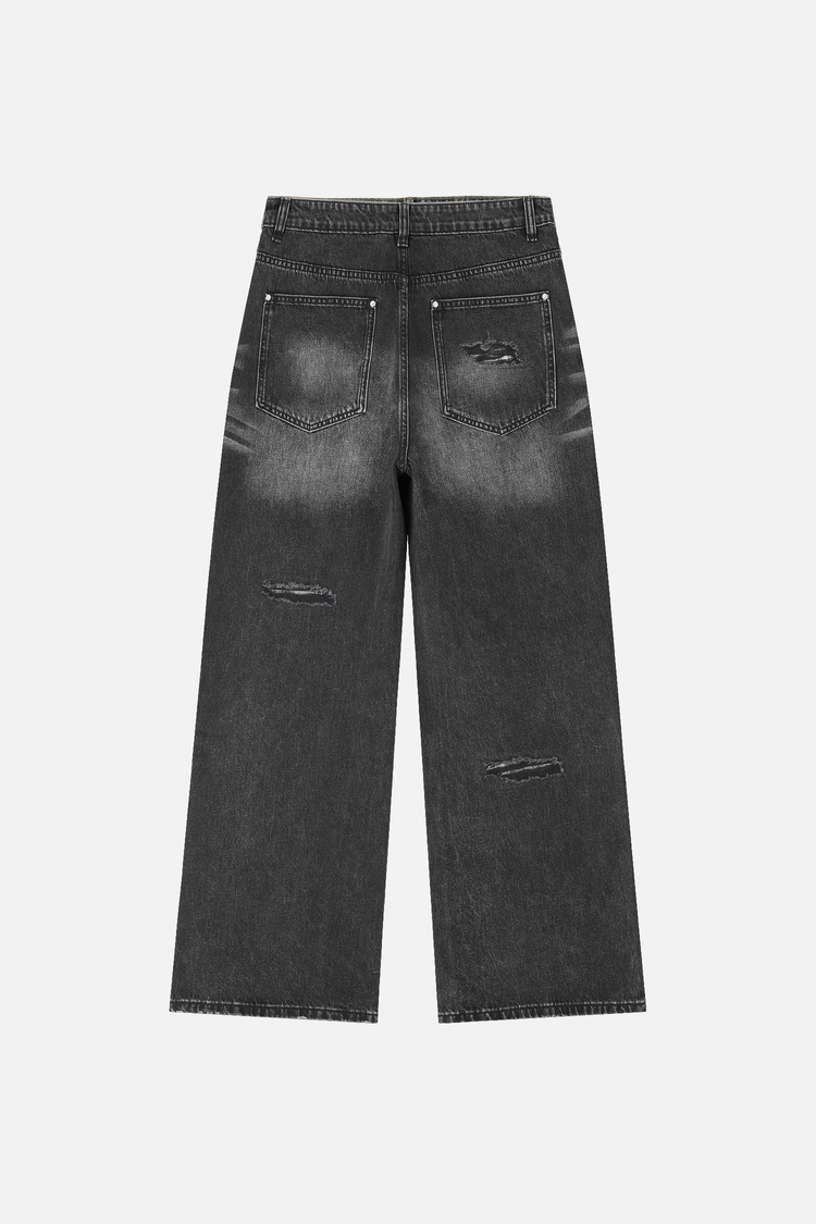 Back of the Plaid Patch Outlaw Denim laid flat, with faded seat and leg rips