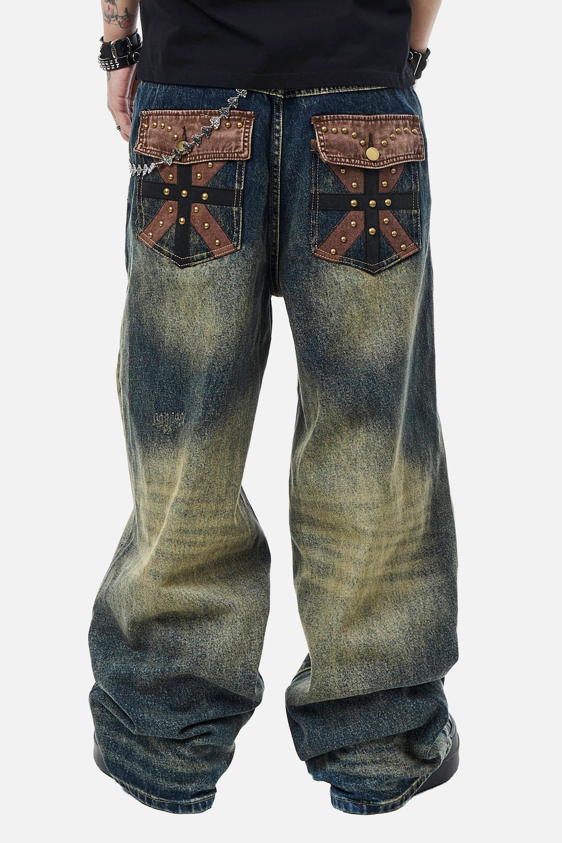 Back close-up of the Embellished Outlaw Denim showing studded leather cross pocket patches