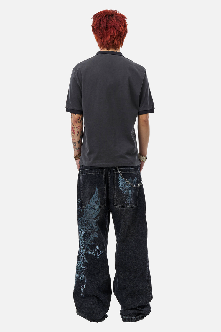 Back view of a model wearing the Heart Motif Pocket Chain on dark baggy jeans with a grey polo
