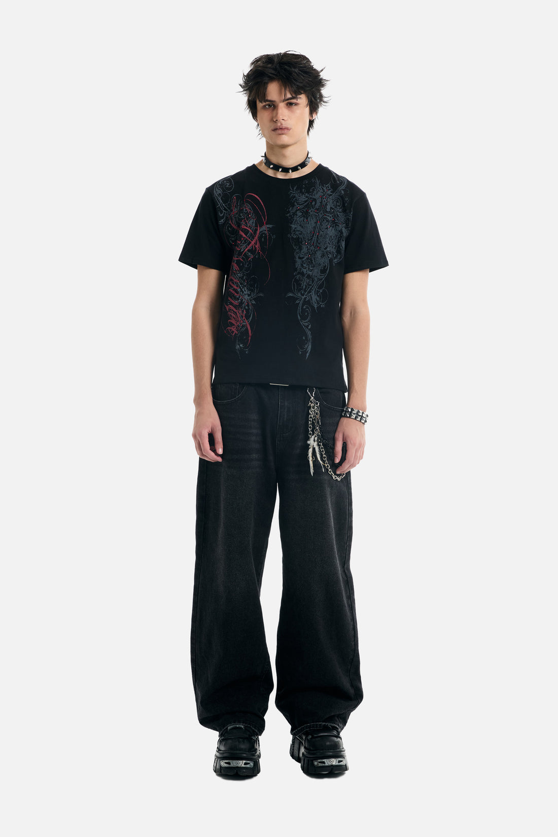 Full-length front view of the Black Scripture Eclipse Tee with baggy black jeans