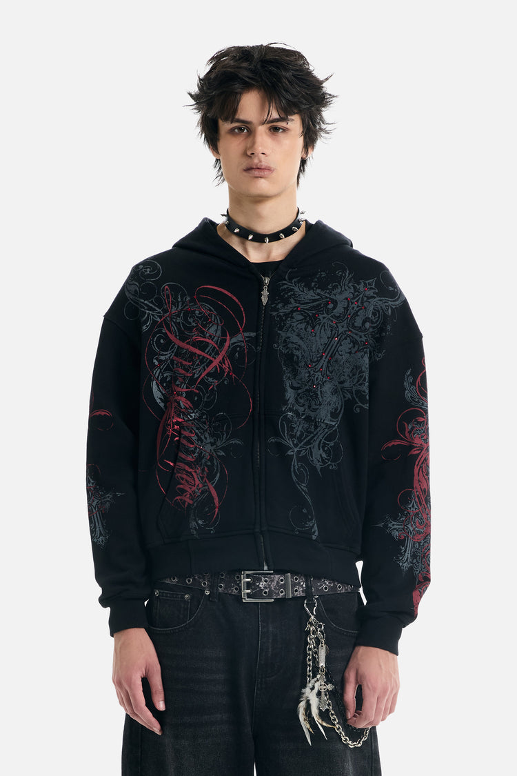 Model wearing the Black Scripture Eclipse Zip Up Hoodie zipped up with black jeans, front view