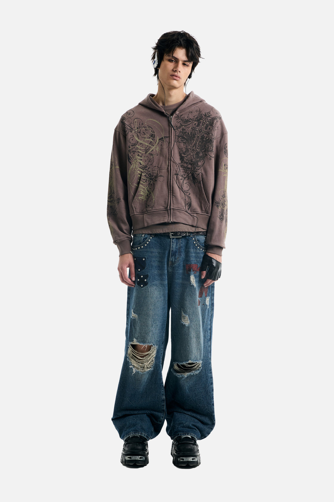 Full-length front view of the Brown Scripture Eclipse Zip Up Hoodie with distressed blue jeans