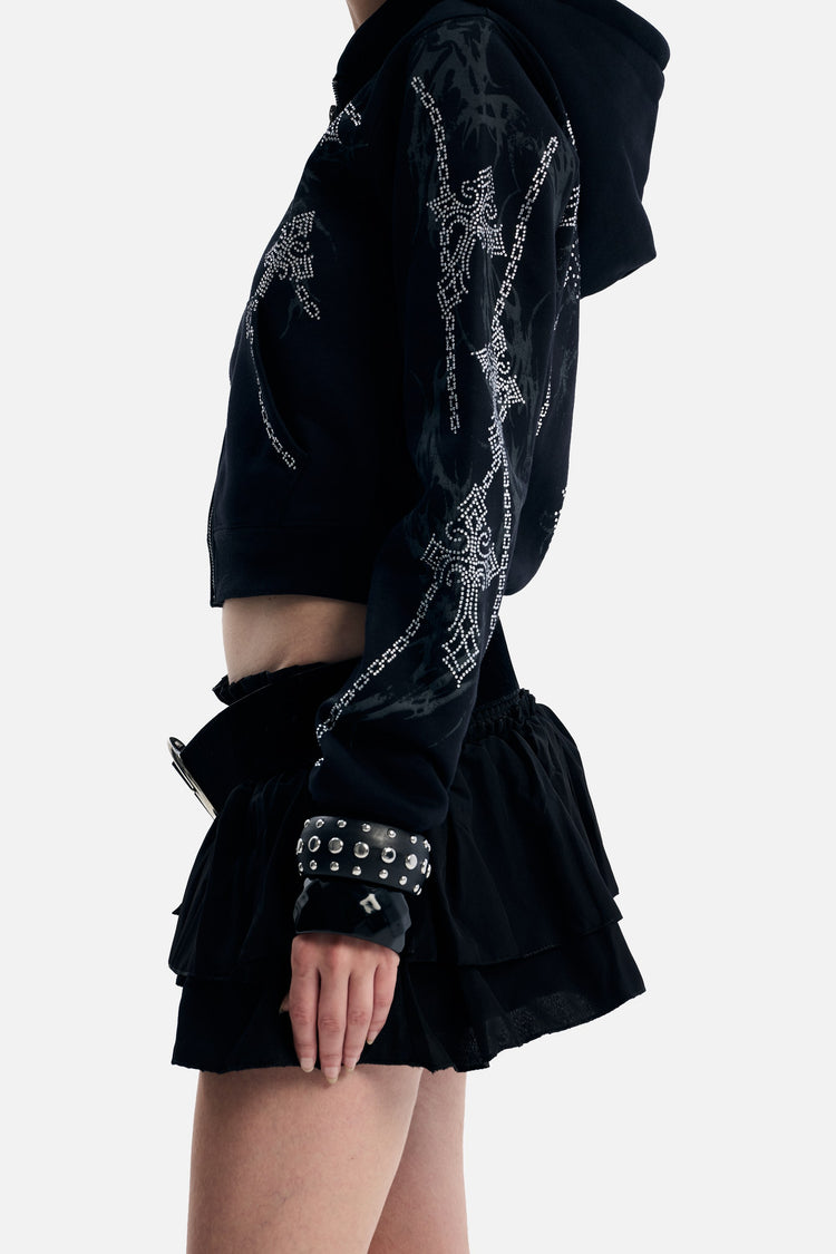 Side detail of the Chain Rhinestone Hoodie sleeve with rhinestone chains
