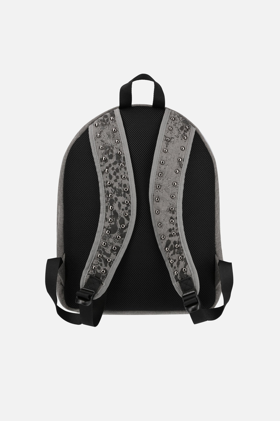 Back of the Denim Cheetah Backpack showing black padded panel and studded straps