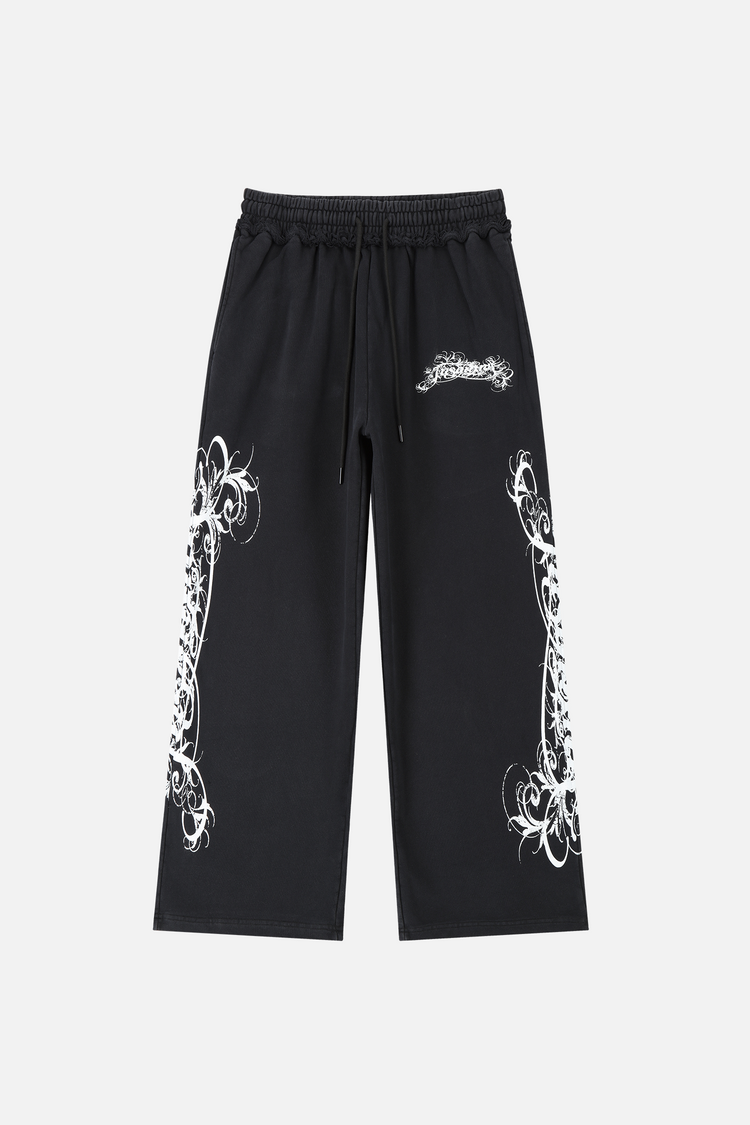 Eternal Sweatpants laid flat, front view, black with white ornate script print down both legs