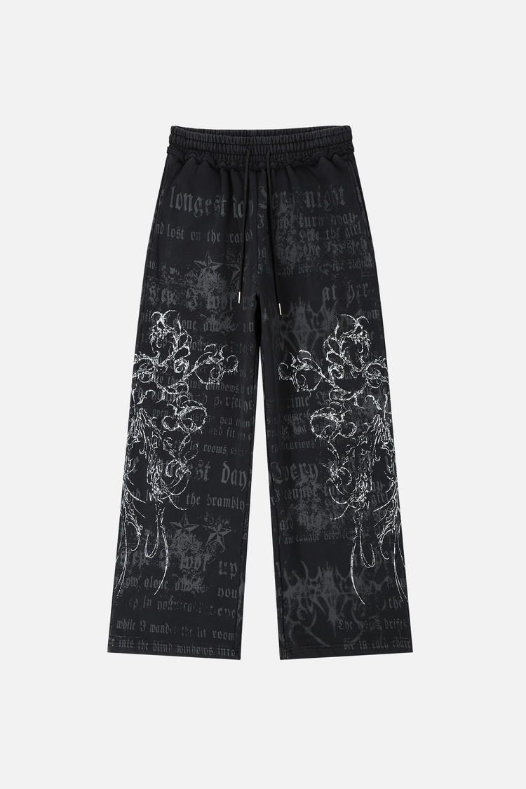 Navy Sacred Sweatpants laid flat, front view with gothic script and white floral graphics