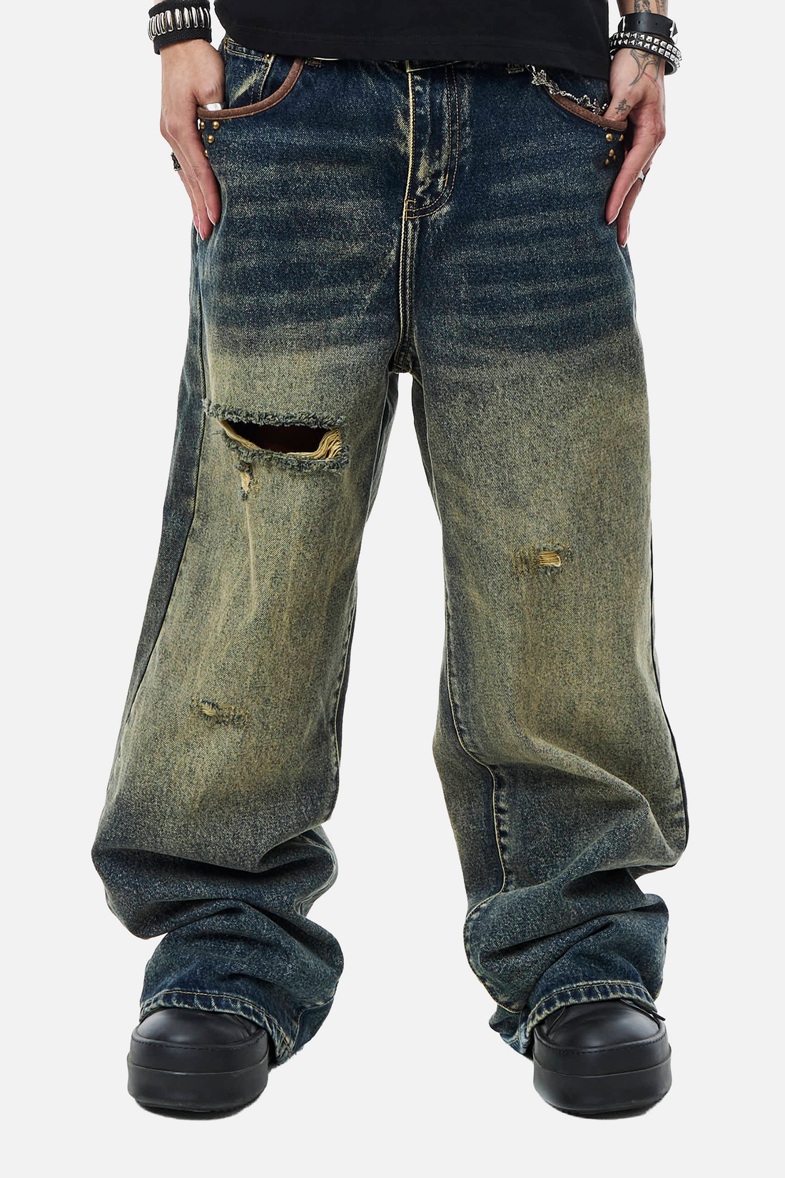 Front view of the faded blue Embellished Outlaw Denim with ripped knee, worn baggy