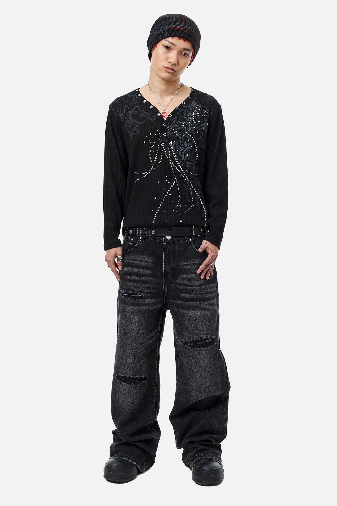 Full-length view of the Fate Ribbed Long Sleeve worn with ripped black wide-leg jeans