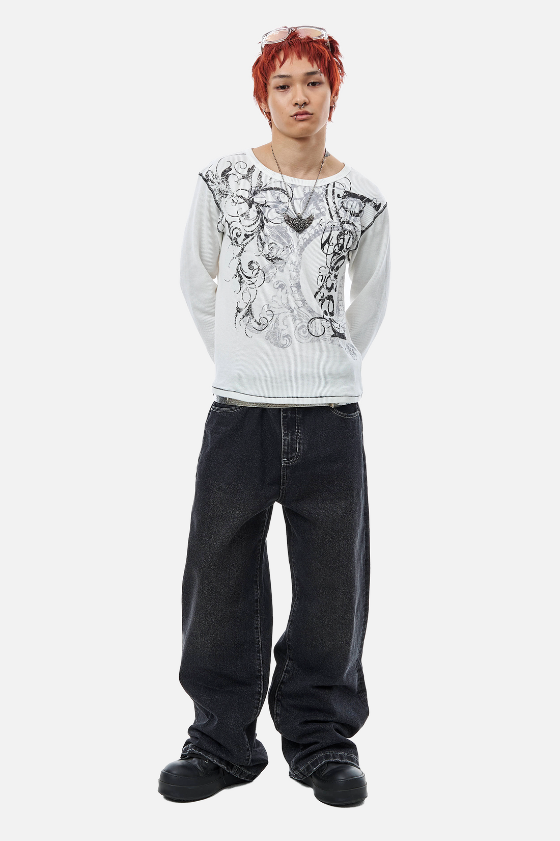Model wearing the Blessed Thermal Long Sleeve with black baggy jeans, full-length front view